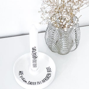 May include: White ceramic candle holder with the text "Wie sch&ouml;n, dass du geboren bist" and "Lass dich feiern" in black lettering.