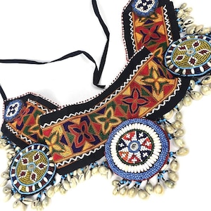 Nomadic tribal Kuchi strap-on statement belt with tribal Kuchi embroidery, tikka patches and natural cowrie shells
