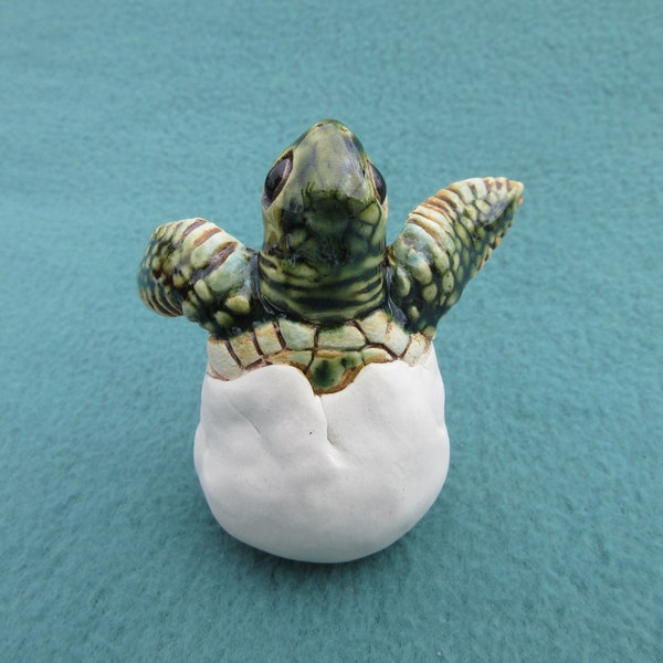 Two-Flipper Hatchling (4 of 7): Life-size, hand-crafted ceramic sea turtle hatchling with two flippers and head emerged from egg