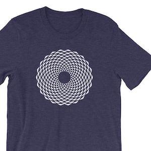 May include: A navy blue t-shirt with a white geometric design in the center. The design is a circle with a series of concentric rings of triangles.
