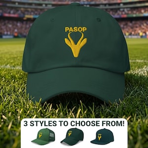 May include: A dark green baseball cap featuring an embroidered yellow logo of a springbok head silhouette above the text PASOP. Below the main cap, a small graphic displays three different cap styles with the text 3 STYLES TO CHOOSE FROM!