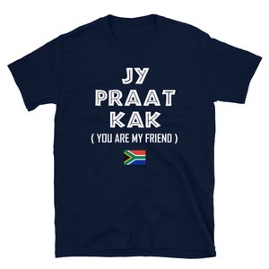 May include: Navy blue t-shirt with white text that reads "Jy Praat Kak (You Are My Friend)" and a South African flag.