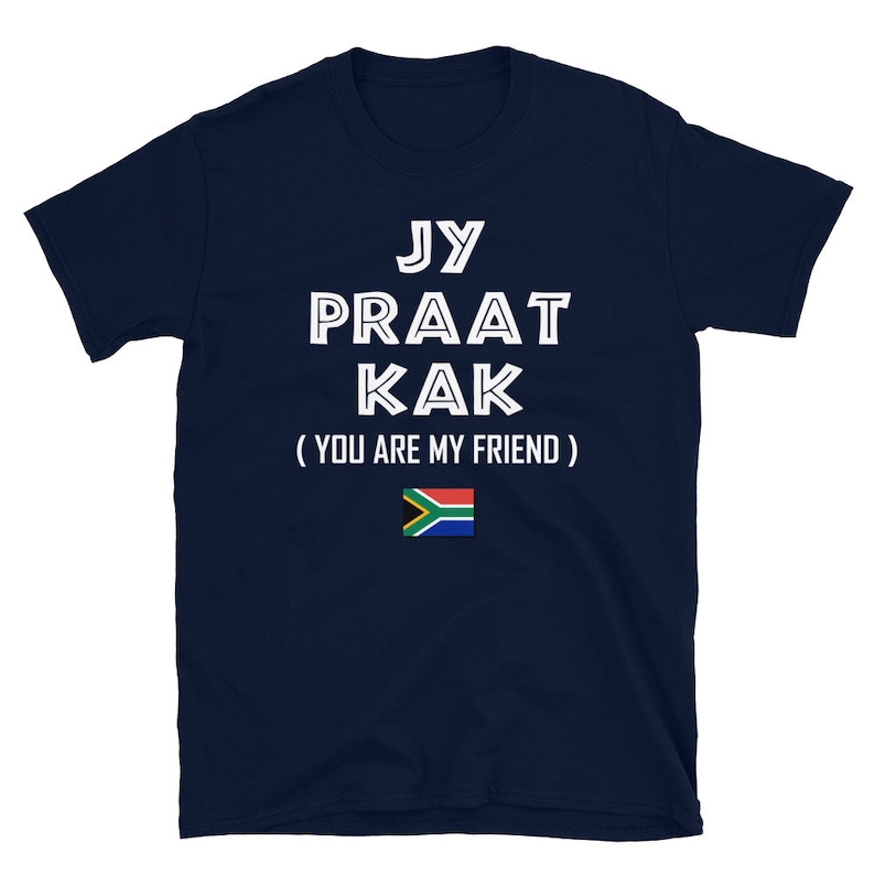 May include: Navy blue t-shirt with white text that reads "Jy Praat Kak (You Are My Friend)" and a South African flag.