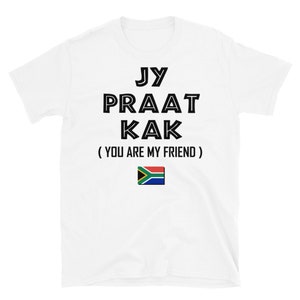 May include: White t-shirt with black text that reads "Jy Praat Kak (You Are My Friend)" and a South African flag.