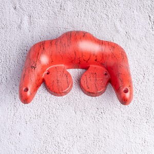 May include: A set of three ceramic mugs with a speckled, matte finish. The mugs are in shades of cream, light gray, and dark gray. Each mug has a simple, minimalist design, perfect for coffee or tea.