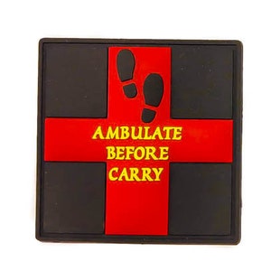 May include: Black and red rectangular sign with the text "AMBULATE BEFORE CARRY" in yellow letters. Two black footprints are above the text.