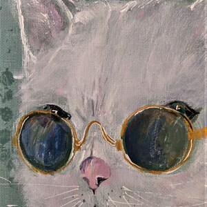 May include: A white cat wearing round, gold-rimmed sunglasses. The cat's fur is painted in a soft, textured style, and the sunglasses have dark lenses. The cat's eyes are visible through the lenses.