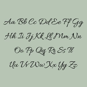 May include: A digital graphic featuring the complete English alphabet in both uppercase and lowercase letters. The characters are rendered in a black, flowing, cursive script font set against a solid, muted sage green background.