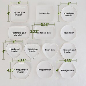 May include: A collection of white ceramic dishes in square, rectangular, heart, hexagon, round, and irregular shapes. Some feature gold or silver rims. Dimensions are labeled in inches, including 4 inches by 4 inches and 5.12 inches by 3.23 inches.