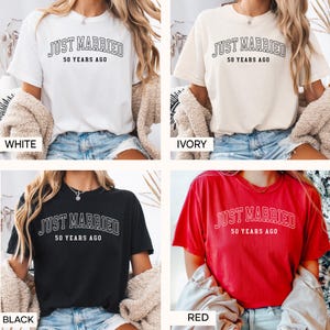 May include: Four t-shirts in white, ivory, black, and red, each with the text "JUST MARRIED 50 YEARS AGO" in a bold, outlined font. The shirts are short-sleeved and appear to be made of a soft material.