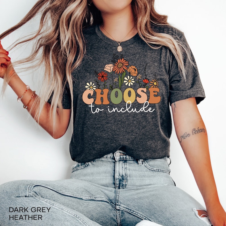 May include: Dark grey heather t-shirt with a floral design and the text "CHOOSE to include".