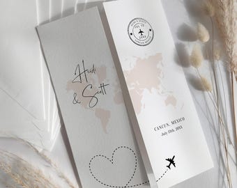May include: Two wedding invitation cards with a travel theme. One card features the names "Heidi & Scott" and a world map. The other card has a stamp design with a plane and the text "Cancun, Mexico, July 13th, 20XX". A dotted line forms a heart and airplane trail.