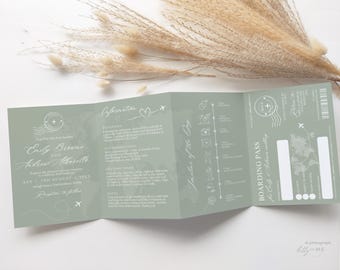 May include: A sage green wedding invitation designed to resemble a boarding pass. The invitation includes the names "Emily Browne" and "Andrew Albarello", along with the wedding date. The design features travel-themed graphics and text.