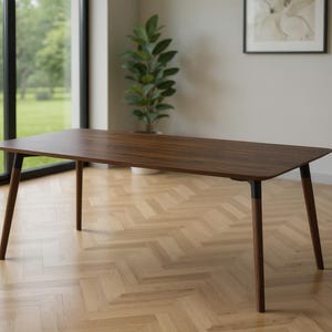 Tapered solid oak table legs - Modern angular joinery - Hand-finished smooth edges - Shows craftsmanship quality