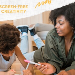 May include: An image shows two people lying on a wooden floor, drawing with markers. The text "SCREEN-FREE CREATIVITY" is visible. One person is wearing a green shirt, and the other is wearing a gray shirt. The image has a warm, inviting feel.