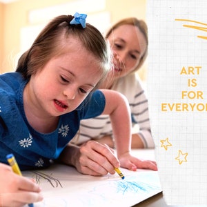 May include: A young person with Down syndrome, wearing a blue dress, draws with a yellow crayon on white paper. The text "ART IS FOR EVERYONE!" is displayed on the right side of the image. A second person is in the background.