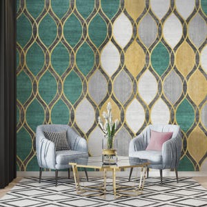 May include: A living room scene featuring a patterned wallpaper in teal, gray, white, and gold. Two light blue armchairs with pillows face a glass-topped coffee table. A black and white geometric rug completes the decor.