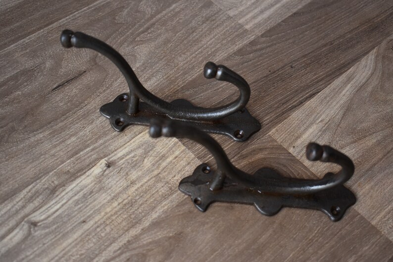 old cast iron hooks