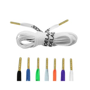 May include: White shoelaces with gold aglets and the text "HOELACES" printed on them. The shoelaces are rolled up and the text is visible on the top of the roll. There are six other shoelaces in different colours below the white shoelaces.