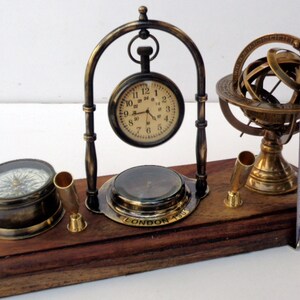 Antique brass table top clock with pen holder compass armillary sphere globe clock desk top wooden base image 7