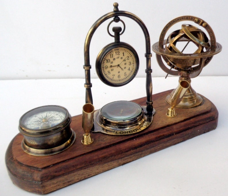 Antique brass table top clock with pen holder compass armillary sphere globe clock desk top wooden base image 2