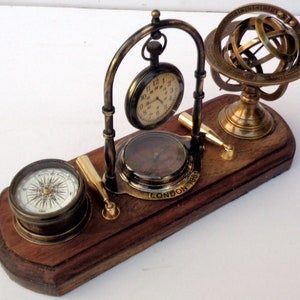 Antique brass table top clock with pen holder compass armillary sphere globe clock desk top wooden base image 9