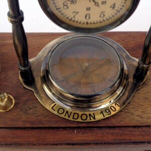 Antique brass table top clock with pen holder compass armillary sphere globe clock desk top wooden base image 4