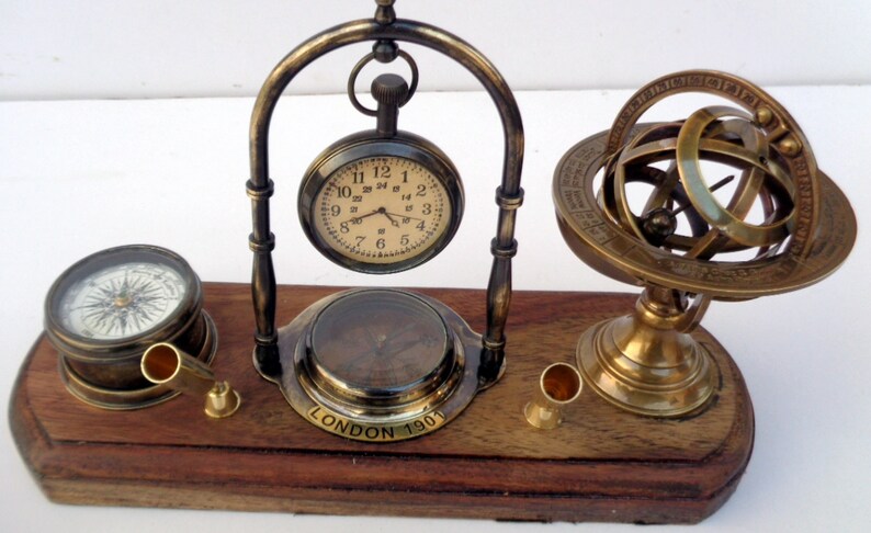 Antique brass table top clock with pen holder compass armillary sphere globe clock desk top wooden base image 3