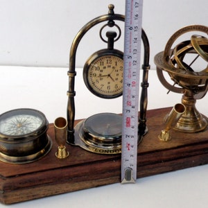 Antique brass table top clock with pen holder compass armillary sphere globe clock desk top wooden base image 6