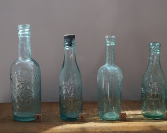 Embossed Vintage Glass Bottle: Green Decorative Vase