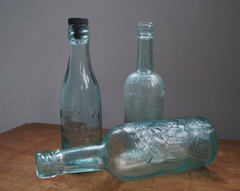 Embossed Vintage Glass Bottle: Green Decorative Vase