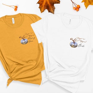 May include: Two t-shirts with a pumpkin design. The shirt on the left is mustard yellow and says "Bride to be Maid of Honor". The shirt on the right is white and says "Bride to be Bride".