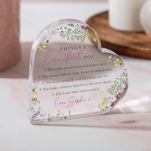 May include: A clear, heart-shaped acrylic block with floral accents and the text "THINGS I love about YOU..." in pink. The block lists five reasons why someone is loved, signed "Love, Sophie x".