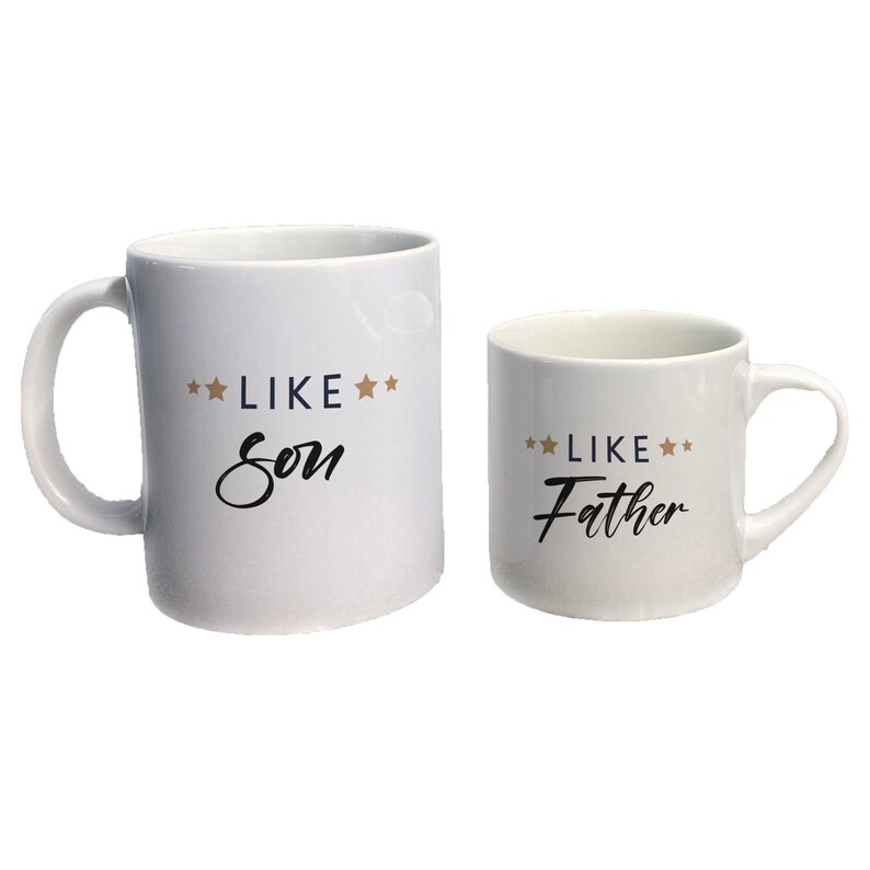 May include: Two white ceramic mugs with black text. The larger mug says "**LIKE** **Son**" and the smaller mug says "**LIKE** **Father**".