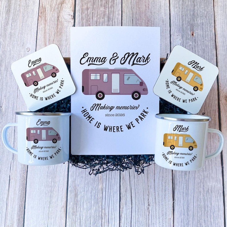 May include: A gift set featuring a purple and yellow camper van design. Includes two white enamel mugs and two coasters, each with a camper van illustration and the text "Home is where we park." A central card displays the names "Emma & Mark."