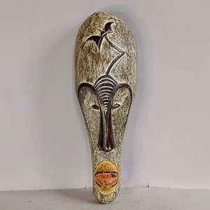 A Lovely Vintage, Tribal, Hand carved, Guro Tribal Mask, featuring Pink + Pastel Pigments Wall decor from Ivory Coast, Cote d&#39;Ivoire, Africa