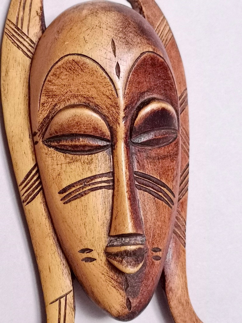 possibly from Ivory Coast Cote d/'Ivoire and found in France A Lovely decorative Hand carved Small Tribal Passport type Mask