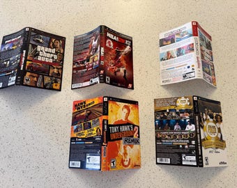 May include: Four video game cases for the PSP console, including Grand Theft Auto Liberty City Stories, NBA 2K12, Grand Theft Auto Vice City Stories, Tony Hawk's Underground 2 Remix, and World Series of Poker 2007 Edition, displayed as flat covers.