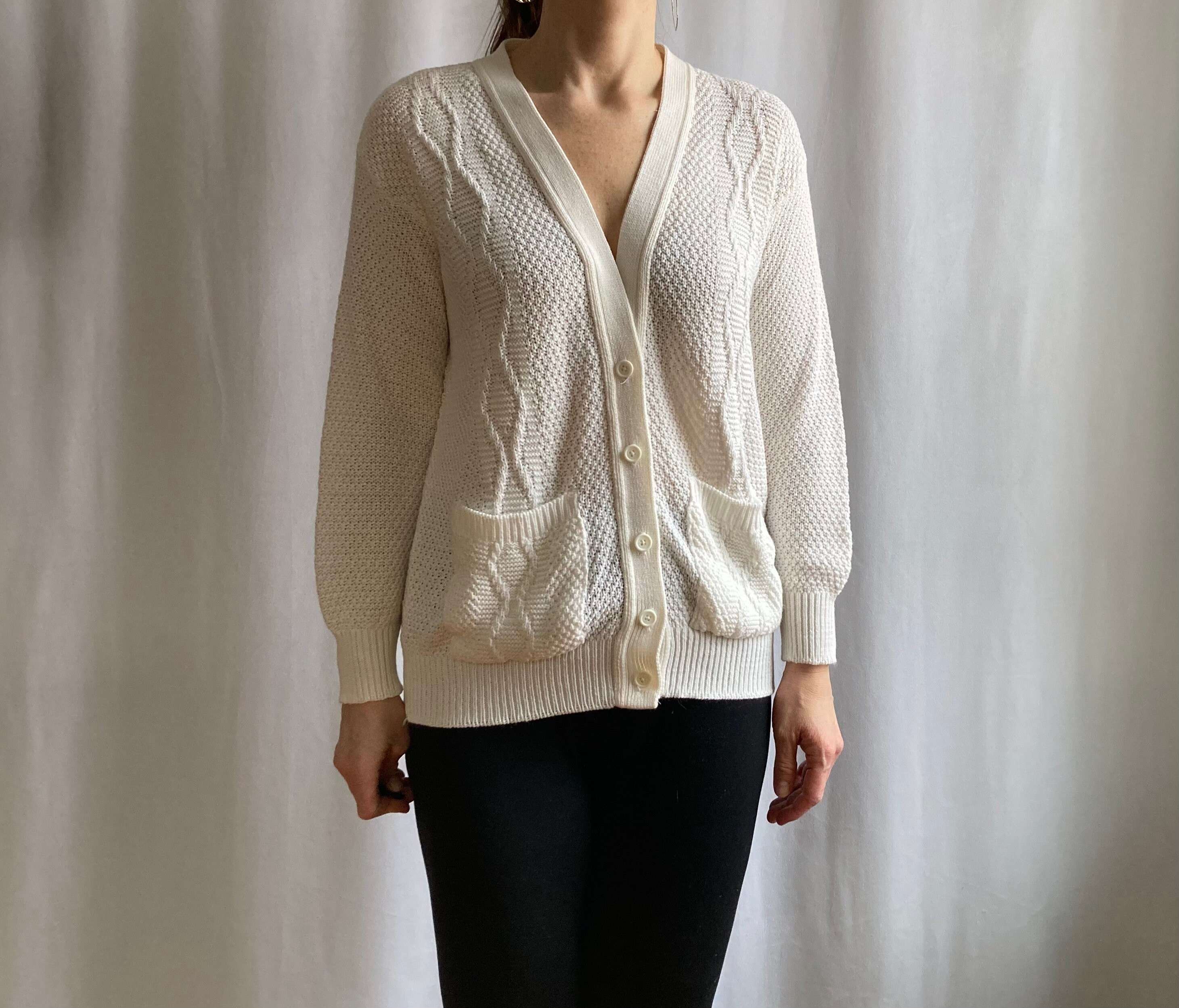 white cable knit button down sweater
