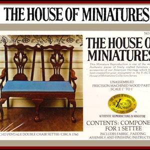 May include: A miniature Chippendale double chair settee kit from The House of Miniatures. The kit includes unassembled precision machined wood parts, fabric, padding, and instructions. The settee has a blue seat and is scaled 1" to 1'. Circa 1760.