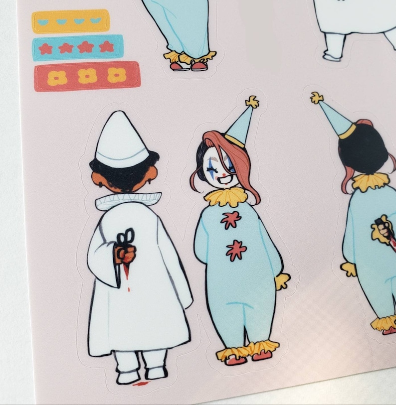 May include: Three illustrated stickers featuring a person in a white coat holding scissors with blood dripping, a clown with a red and blue costume and a yellow star pattern, and another clown with a black and blue costume holding a knife.