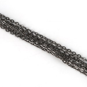 May include: A close-up of a silver chain with multiple strands. The chain is made of small, oval-shaped links.