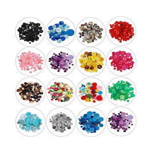 May include: Assortment of colourful buttons in various sizes and shapes, including black, blue, pink, purple, yellow, red, brown, green, light blue, grey, and dark purple.