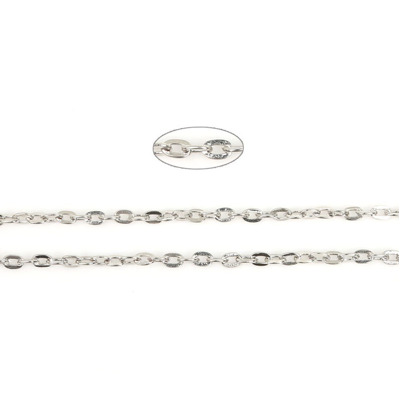 May include: Silver chain with oval links. The chain is made of metal and has a polished finish.