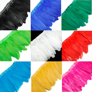 May include: Ten different colours of feather trim, each colour is shown in a separate square. The feather trim is made of natural feathers and is approximately 1 inch wide. The colours are black, blue, green, lime green, white, red, turquoise, yellow, and pink.