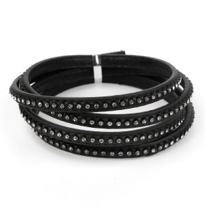 May include: A black leather bracelet with multiple rows of rhinestones.