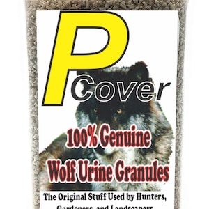 May include: A clear plastic container with a red lid filled with brown granules. The label reads "Cover 100% Genuine Wolf Urine Granules The Original Stuff Used by Hunters, Gardeners, and Landscapers" with a barcode and "16 oz".