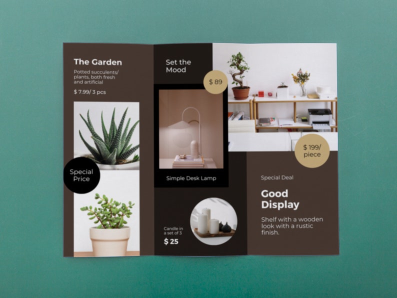 May include: A tri-fold brochure advertising home decor items. The left panel features potted succulents with the text "The Garden" and "$7.99/3 pcs". The center panel shows a simple desk lamp and candles with the text "Set the Mood" and prices. The right panel features a wooden shelf with the text "Good Display" and "$199/piece".