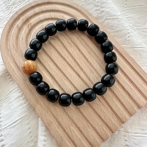 Natural Bodhi Bead Bracelet with Carved Walnut, Black Barrel beads, Handmade Anxiety Relief Fidget Jewelry | Calming and spiritual gift idea