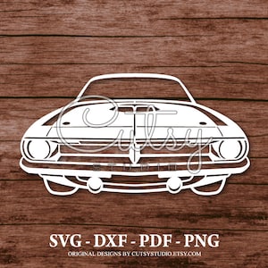 May include: White silhouette of a classic car, front view, with a long hood and a prominent grille. The car has a simple design with rounded edges and a large, open grille. The image is set against a woodgrain background.